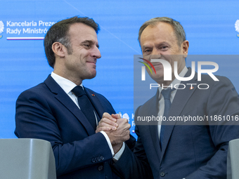 French President Emmanuel Macron (L)  and Prime Minister Donald Tusk after a  press meeting at the Prime Minister's Office in Warsaw. The le...