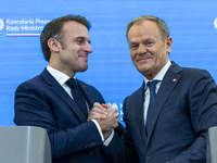 French President Emmanuel Macron (L)  and Prime Minister Donald Tusk after a  press meeting at the Prime Minister's Office in Warsaw. The le...