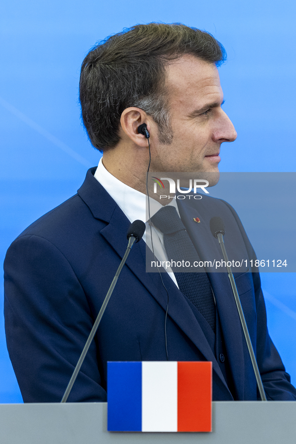 French President Emmanuel Macron speaking to the press after his meeting with Prime Minister Donald Tusk at the Prime Minister's Office in W...