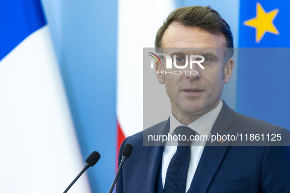 French President Emmanuel Macron speaking to the press after his meeting with Prime Minister Donald Tusk at the Prime Minister's Office in W...