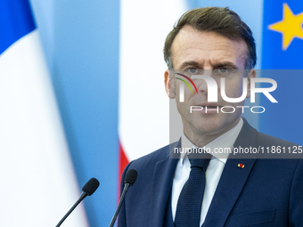 French President Emmanuel Macron speaking to the press after his meeting with Prime Minister Donald Tusk at the Prime Minister's Office in W...