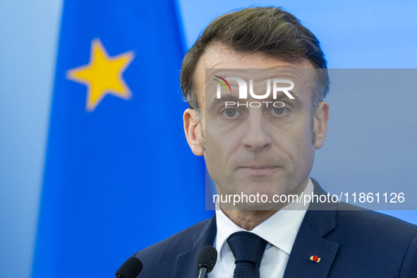 French President Emmanuel Macron speaking to the press after his meeting with Prime Minister Donald Tusk at the Prime Minister's Office in W...