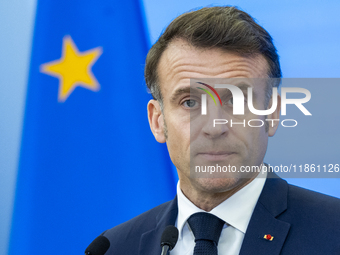 French President Emmanuel Macron speaking to the press after his meeting with Prime Minister Donald Tusk at the Prime Minister's Office in W...