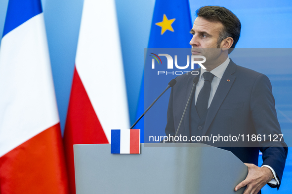 French President Emmanuel Macron speaking to the press after his meeting with Prime Minister Donald Tusk at the Prime Minister's Office in W...