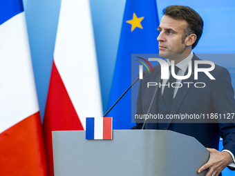 French President Emmanuel Macron speaking to the press after his meeting with Prime Minister Donald Tusk at the Prime Minister's Office in W...