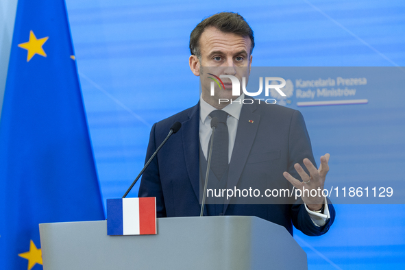 French President Emmanuel Macron speaking to the press after his meeting with Prime Minister Donald Tusk at the Prime Minister's Office in W...