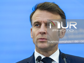 French President Emmanuel Macron speaking to the press after his meeting with Prime Minister Donald Tusk at the Prime Minister's Office in W...