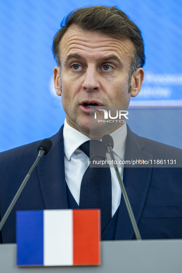 French President Emmanuel Macron speaking to the press after his meeting with Prime Minister Donald Tusk at the Prime Minister's Office in W...