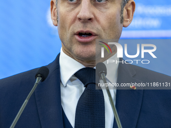 French President Emmanuel Macron speaking to the press after his meeting with Prime Minister Donald Tusk at the Prime Minister's Office in W...