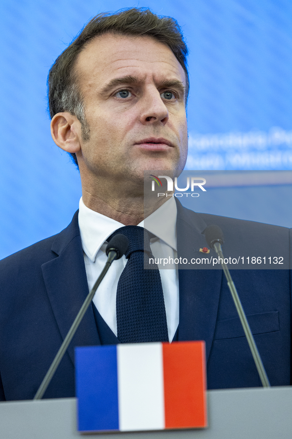 French President Emmanuel Macron speaking to the press after his meeting with Prime Minister Donald Tusk at the Prime Minister's Office in W...