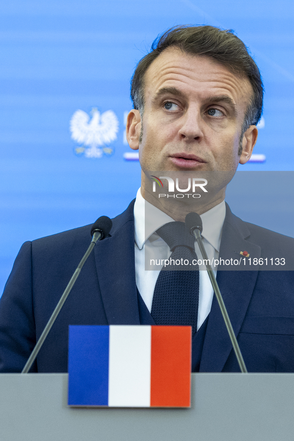 French President Emmanuel Macron speaking to the press after his meeting with Prime Minister Donald Tusk at the Prime Minister's Office in W...