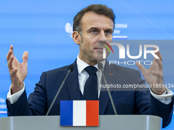 French President Emmanuel Macron speaking to the press after his meeting with Prime Minister Donald Tusk at the Prime Minister's Office in W...