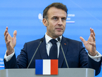 French President Emmanuel Macron speaking to the press after his meeting with Prime Minister Donald Tusk at the Prime Minister's Office in W...