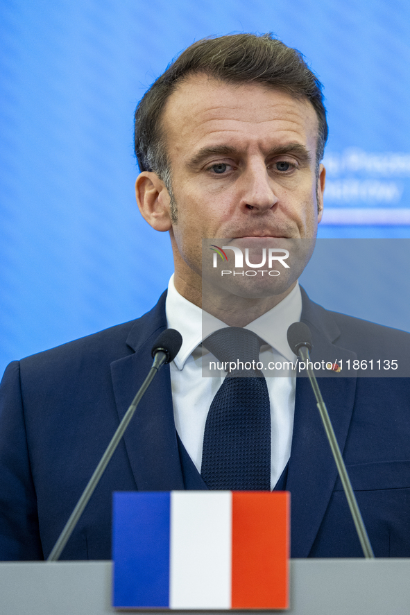 French President Emmanuel Macron speaking to the press after his meeting with Prime Minister Donald Tusk at the Prime Minister's Office in W...