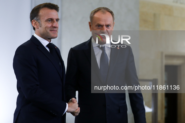 In Warsaw, Poland, on December 12, 2024, French President Emmanuel Macron meets with Polish Prime Minister Donald Tusk at the Chancellery of...