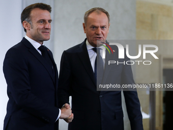 In Warsaw, Poland, on December 12, 2024, French President Emmanuel Macron meets with Polish Prime Minister Donald Tusk at the Chancellery of...