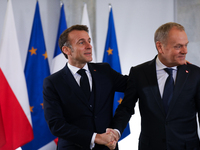 In Warsaw, Poland, on December 12, 2024, French President Emmanuel Macron meets with Polish Prime Minister Donald Tusk at the Chancellery of...