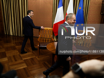 In Warsaw, Poland, on December 12, 2024, French President Emmanuel Macron meets with Polish Prime Minister Donald Tusk at the Chancellery of...