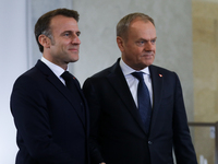 In Warsaw, Poland, on December 12, 2024, French President Emmanuel Macron meets with Polish Prime Minister Donald Tusk at the Chancellery of...