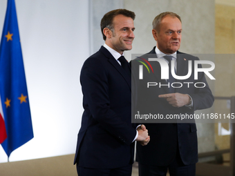 In Warsaw, Poland, on December 12, 2024, French President Emmanuel Macron meets with Polish Prime Minister Donald Tusk at the Chancellery of...