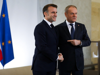 In Warsaw, Poland, on December 12, 2024, French President Emmanuel Macron meets with Polish Prime Minister Donald Tusk at the Chancellery of...