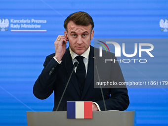 WARSAW, POLAND - DECEMBER 12:
French President Emmanuel Macron delivers remarks during a joint press conference with Polish Prime Minister D...