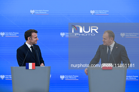 WARSAW, POLAND - DECEMBER 12:
French President Emmanuel Macron (L) during a joint press conference with Polish Prime Minister Donald Tusk (R...