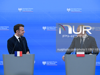 WARSAW, POLAND - DECEMBER 12:
French President Emmanuel Macron (L) during a joint press conference with Polish Prime Minister Donald Tusk (R...