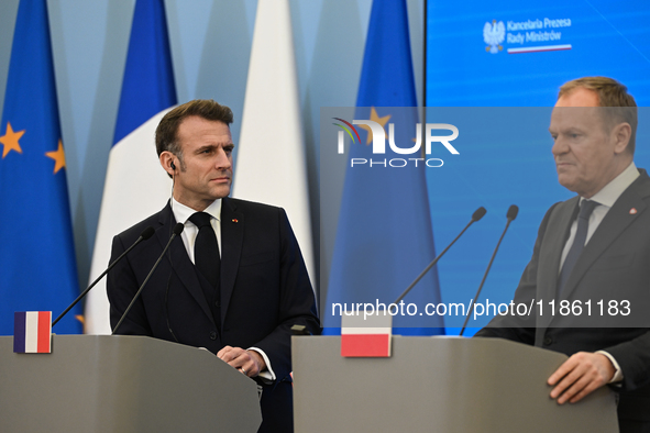 WARSAW, POLAND - DECEMBER 12:
French President Emmanuel Macron (L) during a joint press conference with Polish Prime Minister Donald Tusk (R...