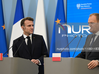 WARSAW, POLAND - DECEMBER 12:
French President Emmanuel Macron (L) during a joint press conference with Polish Prime Minister Donald Tusk (R...