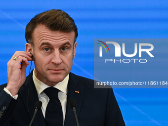 WARSAW, POLAND - DECEMBER 12:
French President Emmanuel Macron delivers remarks during a joint press conference with Polish Prime Minister D...