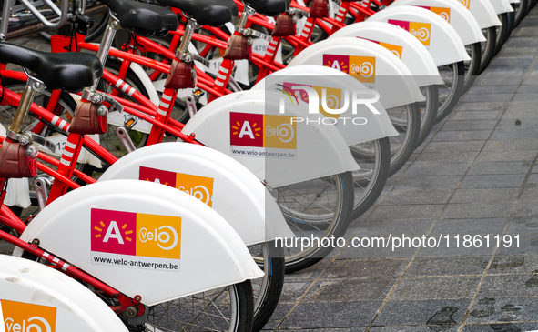 A neatly aligned row of bright red Velo Antwerp bicycles showcases the city's bike rental system in Antwerp, Belgium, on July 31, 2023. The...