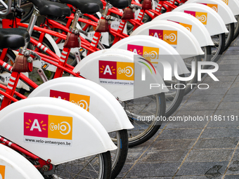 A neatly aligned row of bright red Velo Antwerp bicycles showcases the city's bike rental system in Antwerp, Belgium, on July 31, 2023. The...