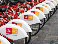 A neatly aligned row of bright red Velo Antwerp bicycles showcases the city's bike rental system in Antwerp, Belgium, on July 31, 2023. The...