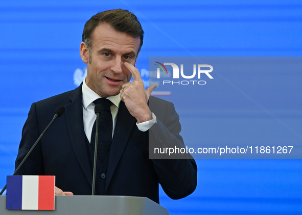 WARSAW, POLAND - DECEMBER 12:
French President Emmanuel Macron delivers remarks during a joint press conference with Polish Prime Minister D...