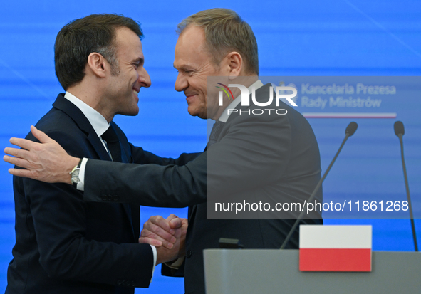 WARSAW, POLAND - DECEMBER 12:
French President Emmanuel Macron (L) and Polish Prime Minister Donald Tusk (R) at the end a joint press confer...