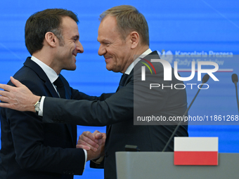 WARSAW, POLAND - DECEMBER 12:
French President Emmanuel Macron (L) and Polish Prime Minister Donald Tusk (R) at the end a joint press confer...