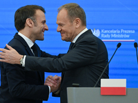 WARSAW, POLAND - DECEMBER 12:
French President Emmanuel Macron (L) and Polish Prime Minister Donald Tusk (R) at the end a joint press confer...