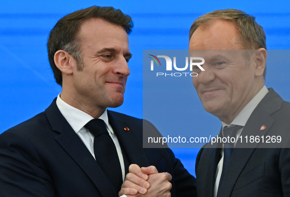 WARSAW, POLAND - DECEMBER 12:
French President Emmanuel Macron (L) and Polish Prime Minister Donald Tusk (R) at the end a joint press confer...