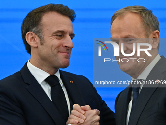 WARSAW, POLAND - DECEMBER 12:
French President Emmanuel Macron (L) and Polish Prime Minister Donald Tusk (R) at the end a joint press confer...