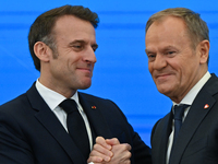 WARSAW, POLAND - DECEMBER 12:
French President Emmanuel Macron (L) and Polish Prime Minister Donald Tusk (R) at the end a joint press confer...