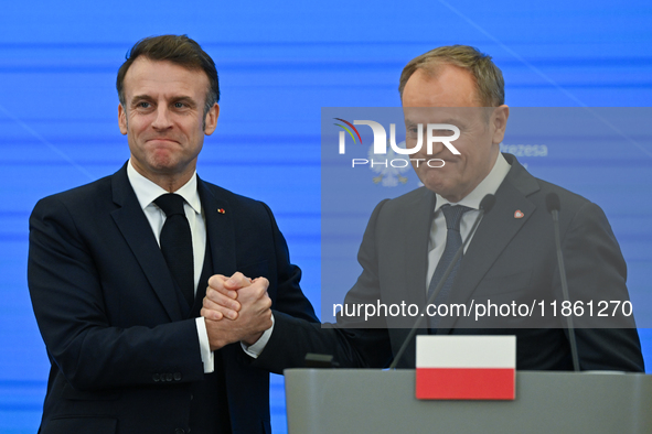 WARSAW, POLAND - DECEMBER 12:
French President Emmanuel Macron (L) and Polish Prime Minister Donald Tusk (R) at the end a joint press confer...