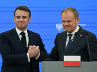 WARSAW, POLAND - DECEMBER 12:
French President Emmanuel Macron (L) and Polish Prime Minister Donald Tusk (R) at the end a joint press confer...