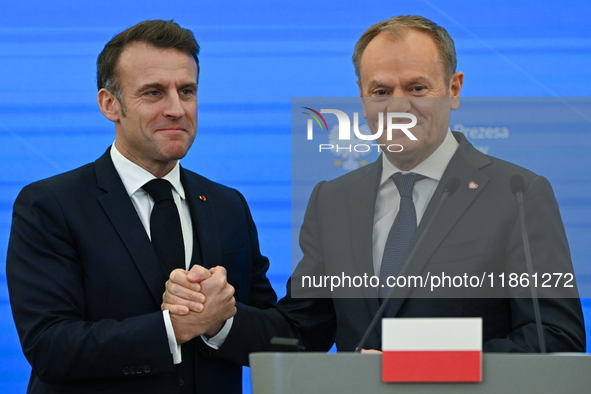 WARSAW, POLAND - DECEMBER 12:
French President Emmanuel Macron (L) and Polish Prime Minister Donald Tusk (R) at the end a joint press confer...