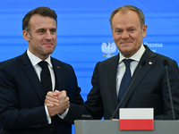 WARSAW, POLAND - DECEMBER 12:
French President Emmanuel Macron (L) and Polish Prime Minister Donald Tusk (R) at the end a joint press confer...