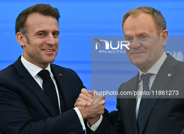 WARSAW, POLAND - DECEMBER 12:
French President Emmanuel Macron (L) and Polish Prime Minister Donald Tusk (R) at the end a joint press confer...