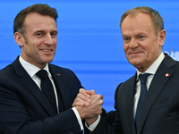 WARSAW, POLAND - DECEMBER 12:
French President Emmanuel Macron (L) and Polish Prime Minister Donald Tusk (R) at the end a joint press confer...