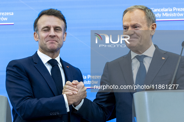 French President Emmanuel Macron, left and Prime Minister Donald Tusk after a  press meeting at the Prime Minister's Office in Warsaw. The l...