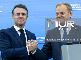 French President Emmanuel Macron, left and Prime Minister Donald Tusk after a  press meeting at the Prime Minister's Office in Warsaw. The l...