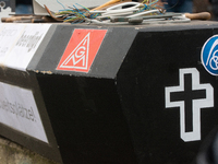 A coffin with the IGM logo is seen as a hundred Thyssenkrupp Europe Steel workers march against planned job cuts before heading to the Works...